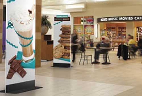 Metal sign base with rigid graphic displayed at shopping mall